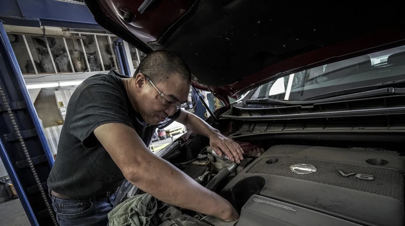 Auto Repair & Service Centers: staff at work in the business, where Reflys automates customer conversations