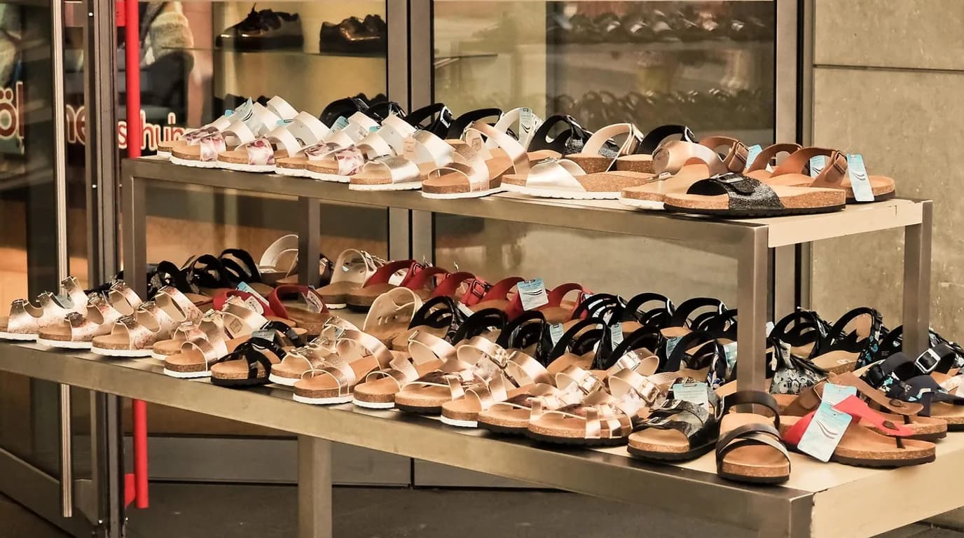 Footwear Retailers: staff at work in the business, where Reflys automates customer conversations