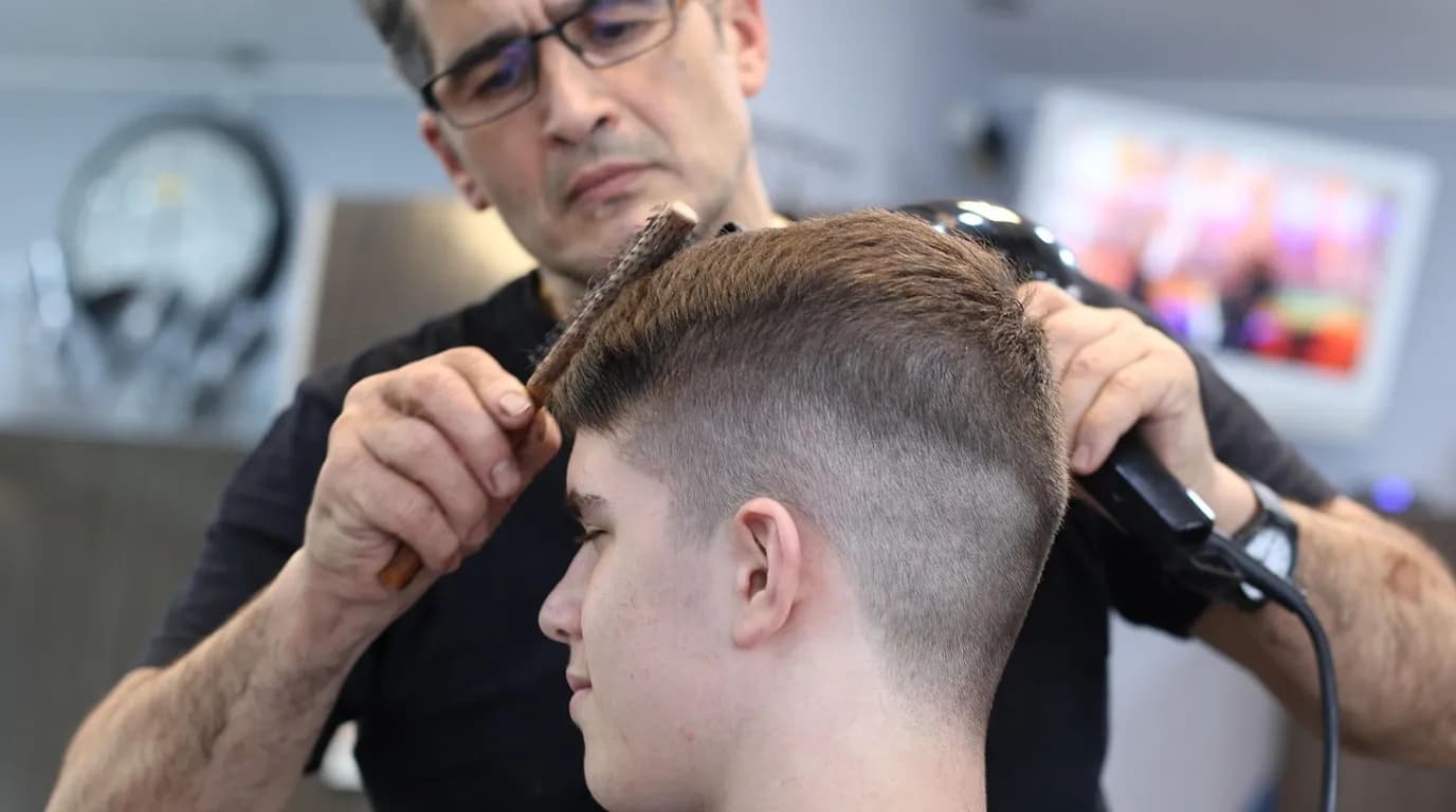 Hair Salons & Barbershops: staff at work in the business, where Reflys automates customer conversations
